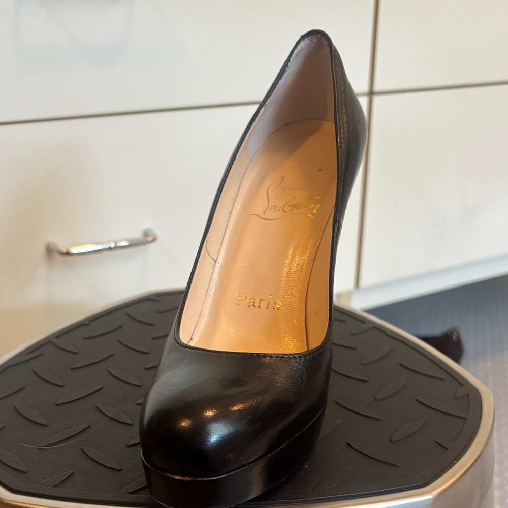 Black Louboutin pumps